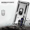 A silver phone case with a ring holder is shown in a dynamic, action-oriented scene, with debris flying around it, suggesting durability and protection. Produktbild-Vorschau