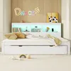 A white bed with storage drawers and a headboard with shelves and LED lighting, decorated with a neon sign and artwork on the wall. Náhled obrázku produktu