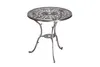 A single round table with an ornate, openwork design on the tabletop and legs, isolated on a white background. Produktbild-Vorschau