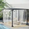 A transparent gazebo with furniture inside, set up next to a swimming pool. Náhled obrázku produktu