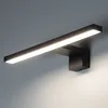 A modern black LED light fixture mounted on a gray wall. Náhľad obrázku produktu