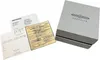 A watch box and documentation are laid out on a white background. Voir les images du produit