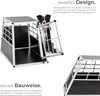 A dog is inside a transport box, with descriptive text about its design and construction. Produktbild-Vorschau