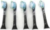 Five black toothbrush heads with blue and green bristles are arranged in a row against a white background. Produktbild-Vorschau