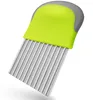 A wavy-edged knife with a green and gray handle, isolated on a white background. Produktbild-Vorschau