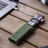 A card reader with multiple SD cards inserted is connected to a laptop on a wooden table. Produktbild-Vorschau