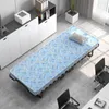 A foldable guest bed with a blue mattress is set up in an office or guest room setting, next to a filing cabinet and office chairs. Anteprima dell’immagine prodotto