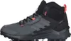 A side view of a gray and black Adidas Terrex hiking boot with coral accents. Produktbild-Vorschau