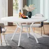 A white round dining table with chairs in a dining room setting. Náhled obrázku produktu