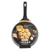 A frying pan for pancakes with pancakes on it, presented on a white background. Podgląd zdjęcia produktu