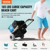 A person is pulling a beach cart loaded with items on a sandy beach. Produktbild-Vorschau