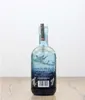 A bottle of Harahorn Norwegian Small Batch Gin is shown from the back on a wooden surface against a white background. Produktbild-Vorschau