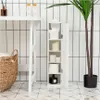 A slim white bathroom cabinet filled with toilet paper and other bathroom essentials, placed next to a tall potted plant. The scene is set against a white tiled wall with black grout lines. Anteprima dell’immagine prodotto