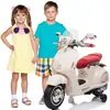 Two children stand next to a cream-colored electric scooter. Podgląd zdjęcia produktu