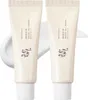 Two tubes of sunscreen are shown side-by-side against a white background. Produktbild-Vorschau