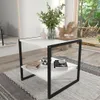 A modern coffee table with a minimalist design, placed in a living room setting with a view of a garden. Produktbild-Vorschau