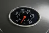 A close-up of a thermometer on a grill. Produktbild-Vorschau