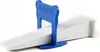A close-up studio shot of a tile leveling clip. Náhľad obrázku produktu