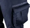 A close-up view of a navy blue cargo pocket on a pair of work pants. Produktbild-Vorschau