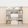 A white bookshelf filled with books and decorative items, placed in front of a window with blinds. Podgląd zdjęcia produktu