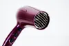 A close-up shot of a purple hairdryer against a white background. Podgląd zdjęcia produktu