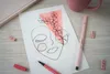 A flat lay of art supplies and a notebook. Produktbild-Vorschau