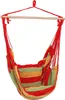 A striped hanging chair suspended from a wooden bar. Náhled obrázku produktu