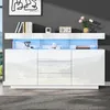 A modern white sideboard with LED lighting, displayed in a room setting with a rug and artwork on the wall. Produktbild-Vorschau