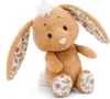 A plush bunny toy is sitting and facing forward against a white background. Produktbild-Vorschau