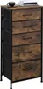 A tall, narrow dresser with five drawers, featuring a rustic wood-grain finish on the drawer fronts and a black metal frame. A black coffee cup and a stack of books are placed on top of the dresser. Produktbild-Vorschau