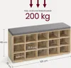 A shoe bench with storage compartments and a grey cushion on top, with dimensions and weight capacity indicated by text and arrows. Produktbild-Vorschau