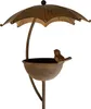 A metal bird feeder shaped like an umbrella with a small bird perched on the edge. Voir les images du produit
