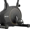 Close-up of the pedal and flywheel area of a black stationary bike. Náhľad obrázku produktu