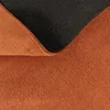 A close-up view of the underside and edge of a rug, showing the texture of the fabric and the anti-slip backing. Produktbild-Vorschau