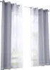 Two sets of curtains hanging on curtain rods, with a view of trees and greenery visible through the sheer inner curtains. Produktbild-Vorschau