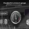 Close-up of a coffee machine's pressure gauge and control knobs, with marketing text overlay. Náhled obrázku produktu