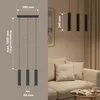 Diagram of a pendant light fixture with dimensions, alongside a lifestyle shot of the fixture installed in a living room. Náhled obrázku produktu