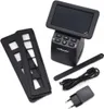 A product shot of a Reflecta x33-Scan digital film scanner and its accessories, laid out on a white background. Produktbild-Vorschau