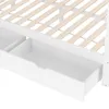 A close-up view of the bottom section of a white bed frame, showing two open drawers underneath. Náhled obrázku produktu