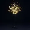 A decorative LED tree with warm white lights against a black background. Produktbild-Vorschau