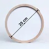 A round wooden clock with a white face, showing its diameter measurement. Produktbild-Vorschau