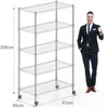 A man in a suit stands next to a five-tier shelving unit. Produktbild-Vorschau