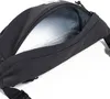 A close-up view of the open main compartment of a black fanny pack. Produktbild-Vorschau