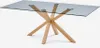 A rectangular glass-top dining table with a wooden base featuring crossed legs, shown against a white background. Anteprima dell’immagine prodotto