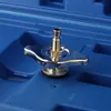 A close-up view of a metal adapter with a nozzle, resting in a blue plastic case. Podgląd zdjęcia produktu