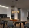 A modern dining room with a table and chairs, illuminated by a pendant light fixture. Produktbild-Vorschau