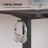 A close-up of a desk with headphones hanging from a hook, highlighting a feature. Voir les images du produit