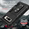 A black phone case with a ring stand is shown on a rocky, mountainous background. Produktbild-Vorschau