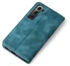 A teal-colored flip phone case is shown on a white background. Produktbild-Vorschau