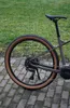 A close-up side view of the rear wheel and drivetrain of a bicycle. Produktbild-Vorschau